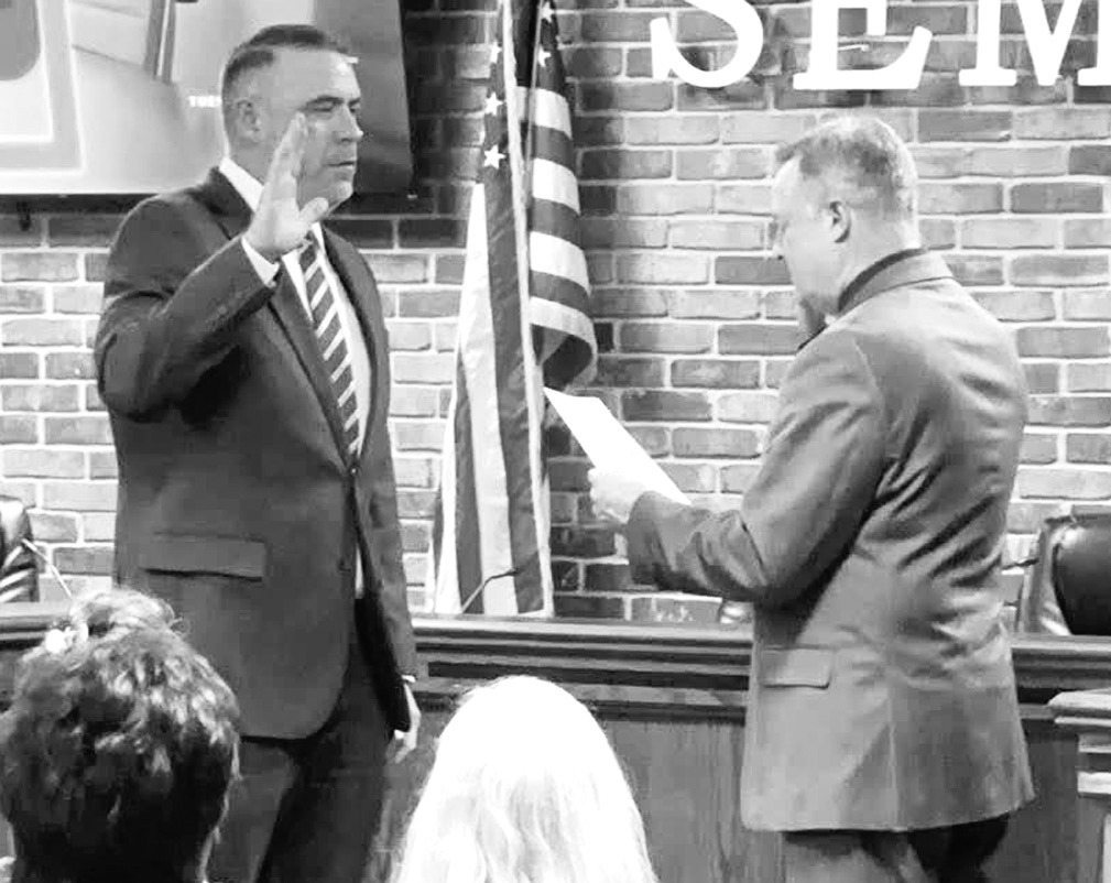 Above, Cory Crabtree was sworn into office as Mayor of Seminole by City Attorney Brad Carter at Tuesday’s city council meeting. Also sworn in were returning councilors Dana Miller (Ward 1) and Chris Anson (Ward 4), newly elected Ward 2 Councilor Jolene 