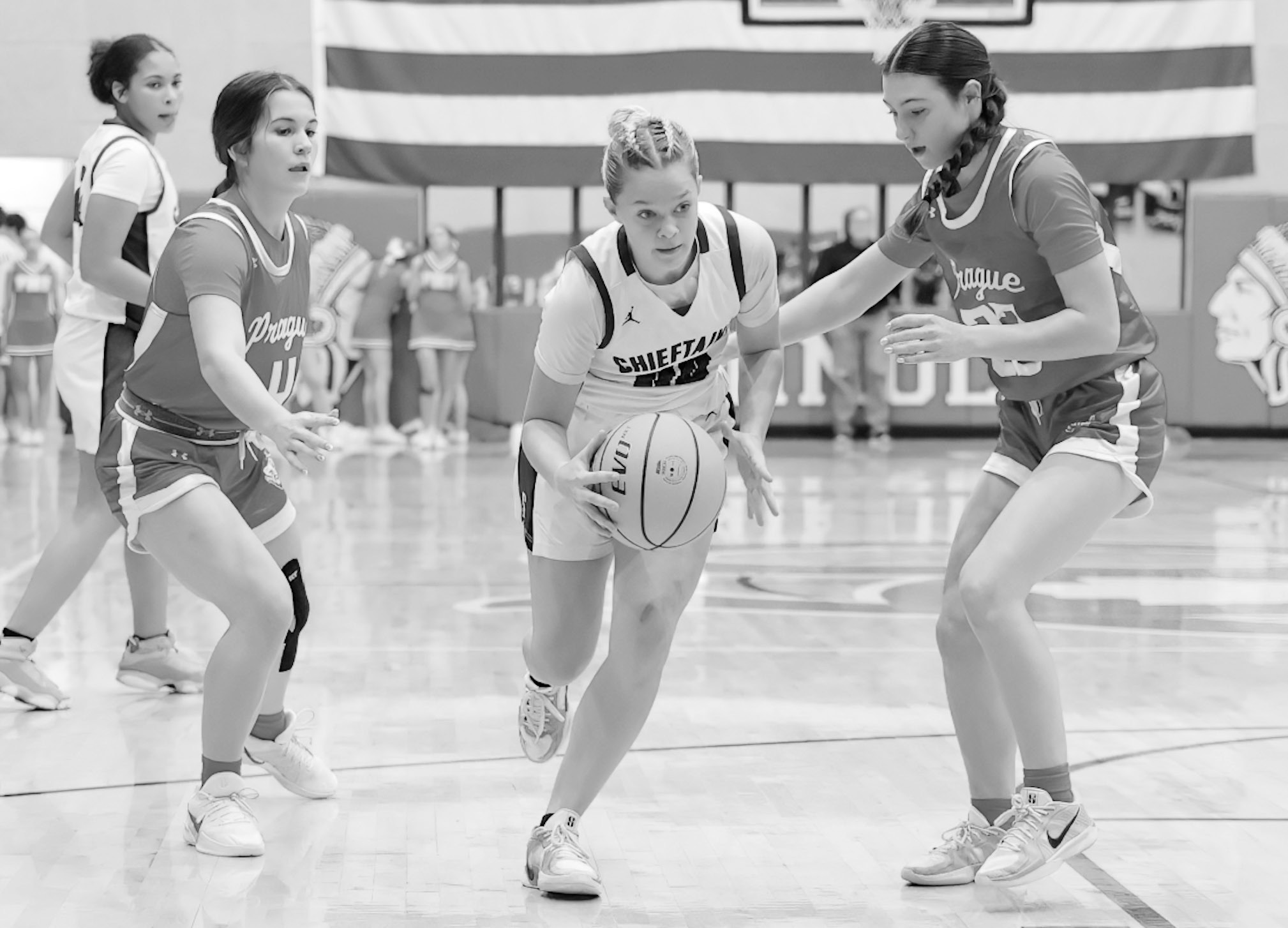 Seminole Lady Chieftain Daisy Wood goes between two defenders on her way to the basket Thursday night. Courtesy Photo by Glen Bryan