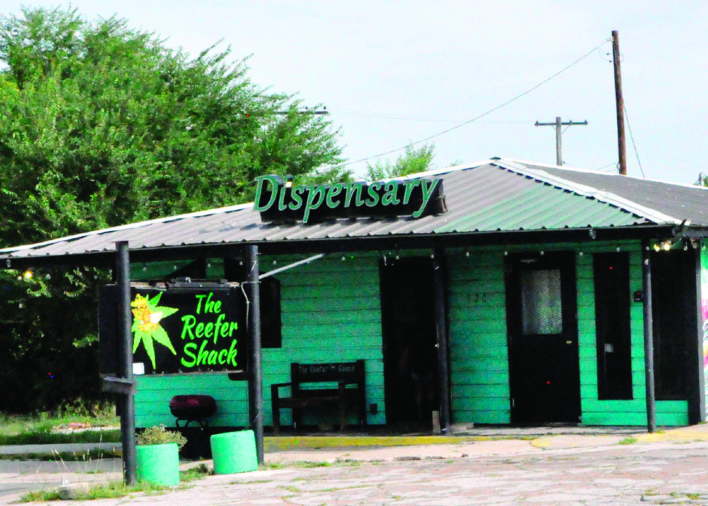 Pictured above is the Reefer Shack at 520 E. Broadway in Seminole. On Friday morning, the store was abuzz with law enforcement activity, as agents with the Oklahoma Bureau of Narcotics served search warrants on the business. (Staff photo by Bill Anderson)