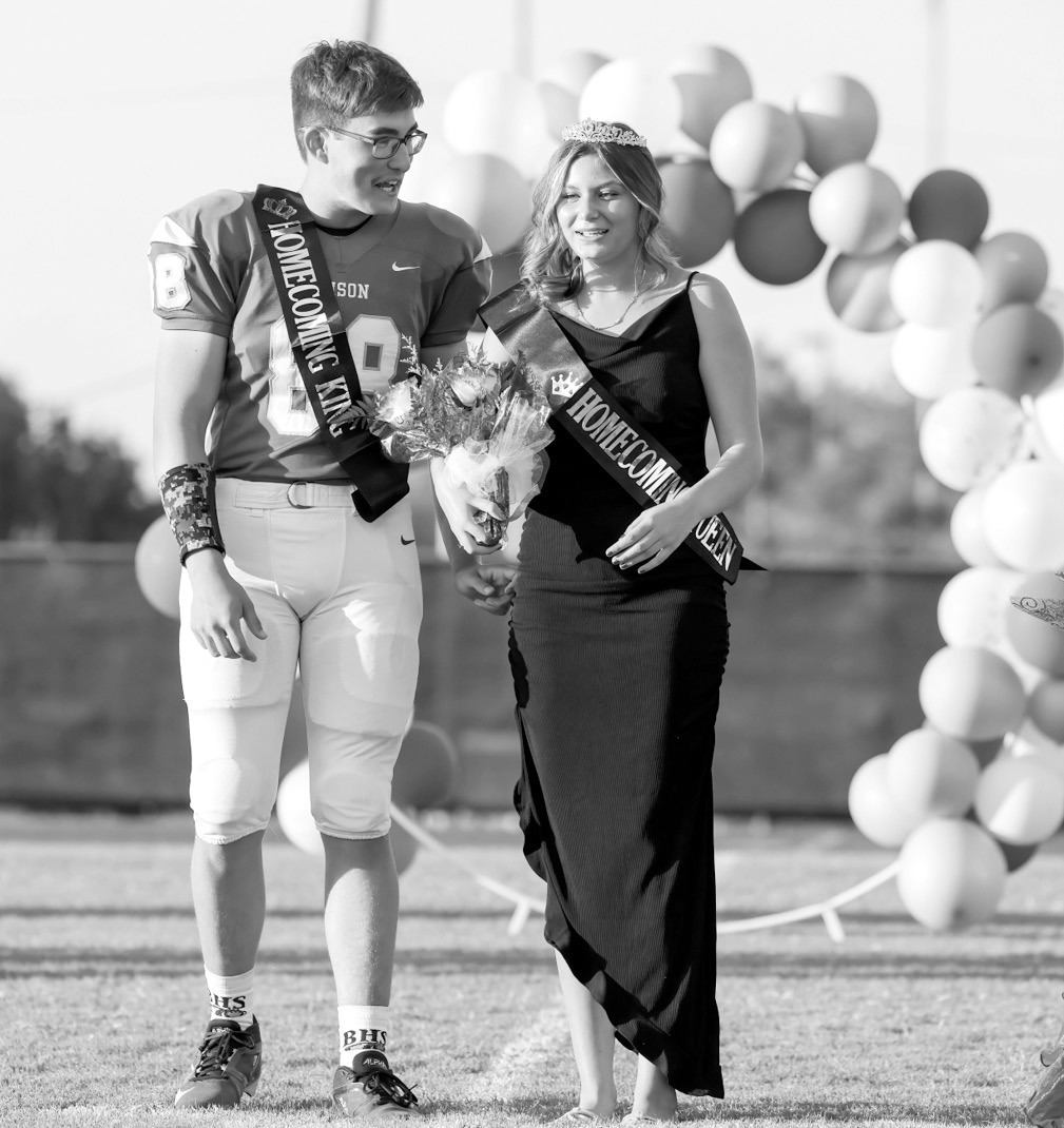 Bowlegs Homecoming King Camden Morgan and Queen Gracie Taylor pose together on the field after coronation ceremonies Friday night, Oct. 3. It was a sweet homecoming for Bowlegs, as the football team defeated Graham-Dustin by a score of 52-6. —Photo by G
