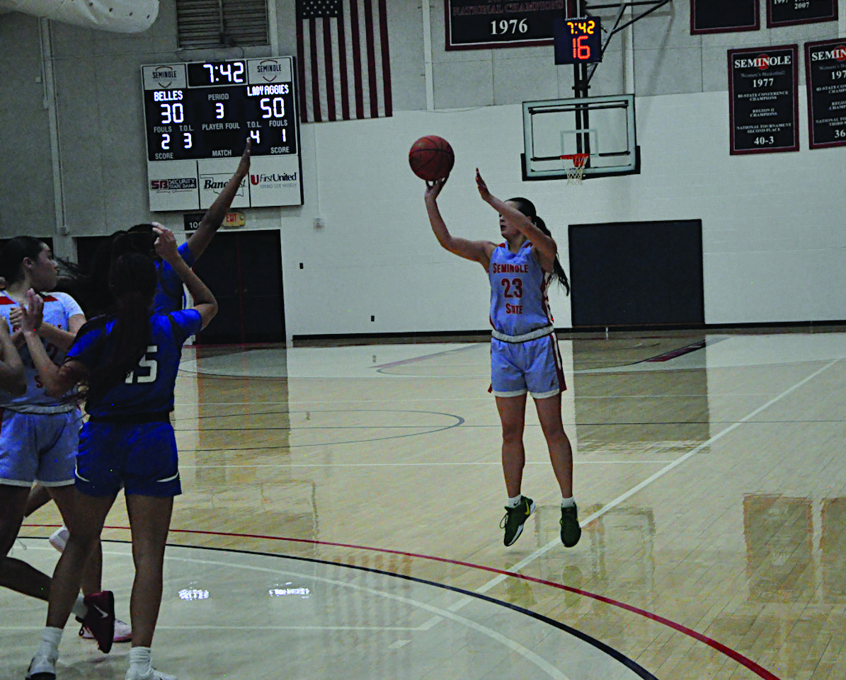 Seminole State Lady Belle Alona Cooper shoot from three-point range Thursday night. Staff Photo by Bill Anderson
