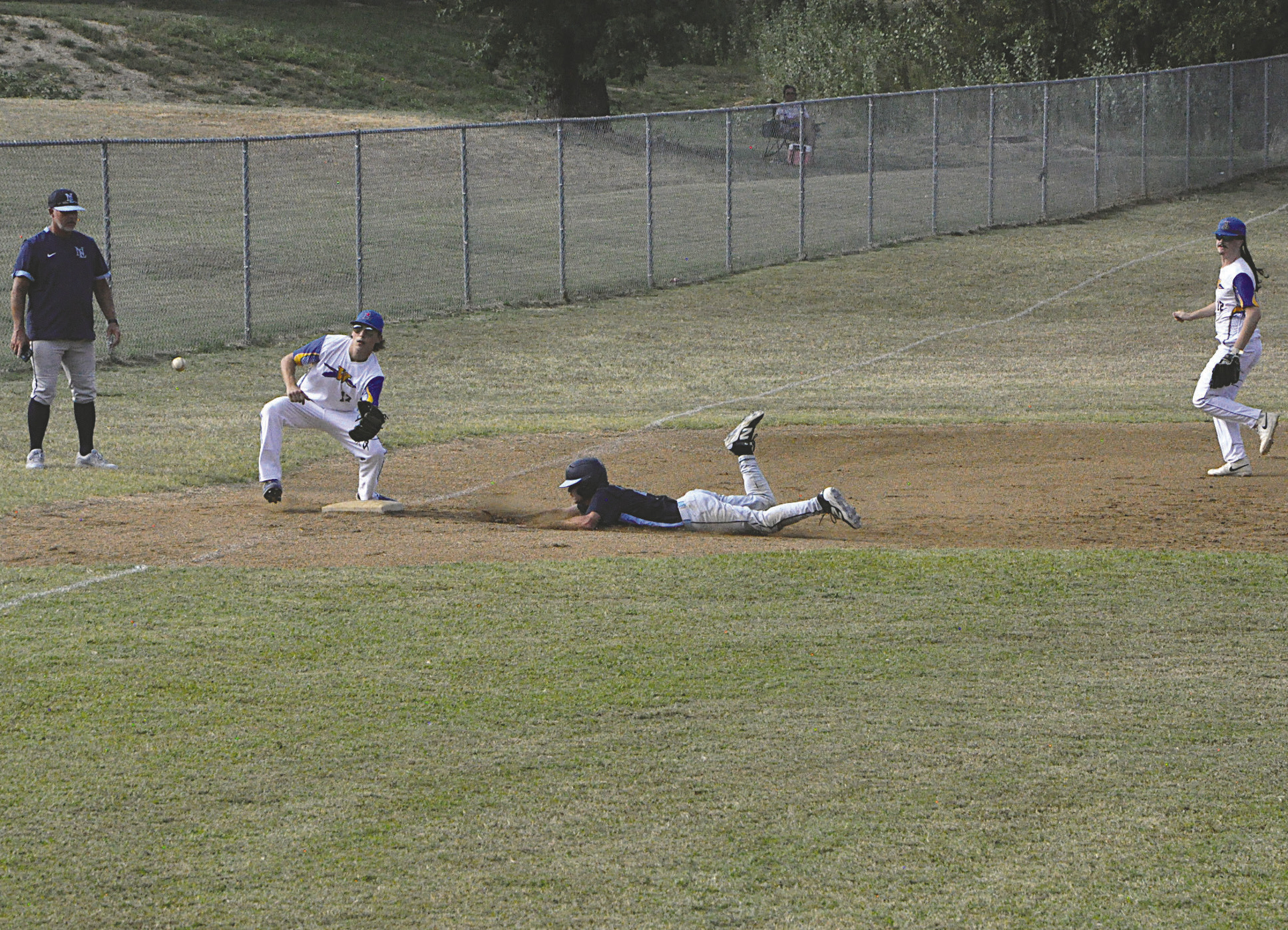 New Lima Woodrow Neal slides into third for the steal Thursday. Neal was safe and later scored on a steal of home. Staff Photo by Bill Anderson