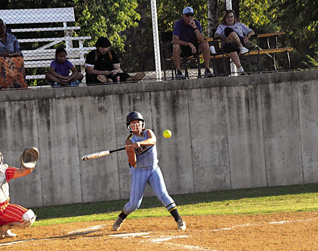 New Lima Falconette Krissy Griffis knocks the ball into the outfield Thursday. Staff Photo by Bill Anderson