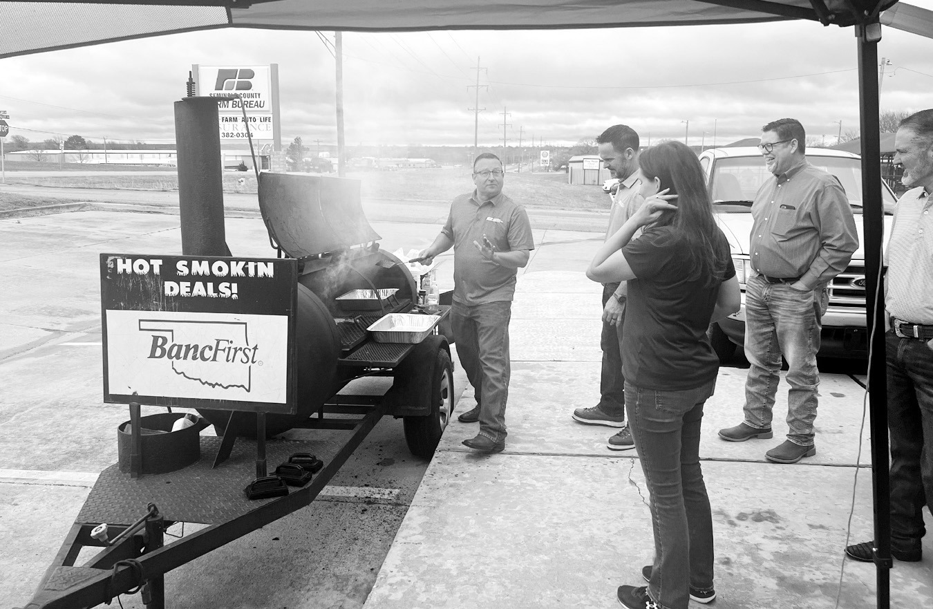 James Whitson, District Manager for Oklahoma Farm Bureau Insurance, cooks up hamburgers during a customer appreciation event held last Friday at the Seminole office on Wrangler. Also pictured are Shawn Streater, Agent; Kari Kiker, Agent; Curt Potter, Spec