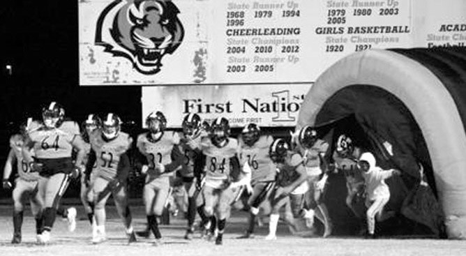 The Wewoka Tiger football team is seen entering the stadium in this file photo. The Wewoka Public School District says security will be beefed up as Wewoka takes on Konawa in tonight’s season opener.