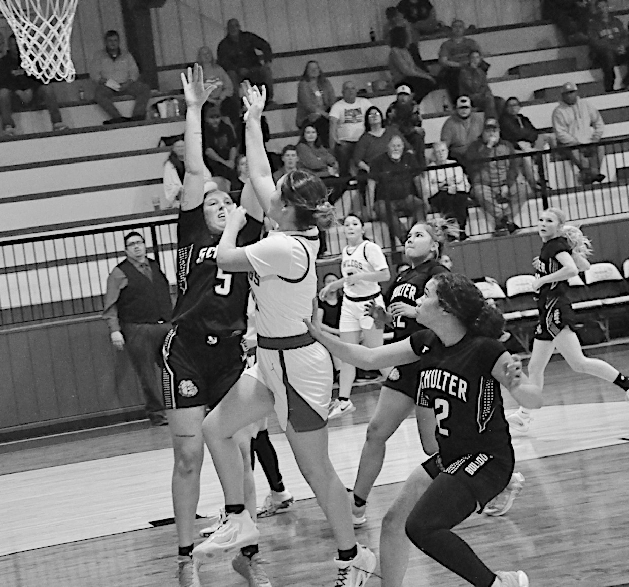 Bowlegs Lady Bison Cira Parsons drives in for the shot against Schulter Friday night. Bowlegs won 47-27. Staff Photo by Bill Anderson