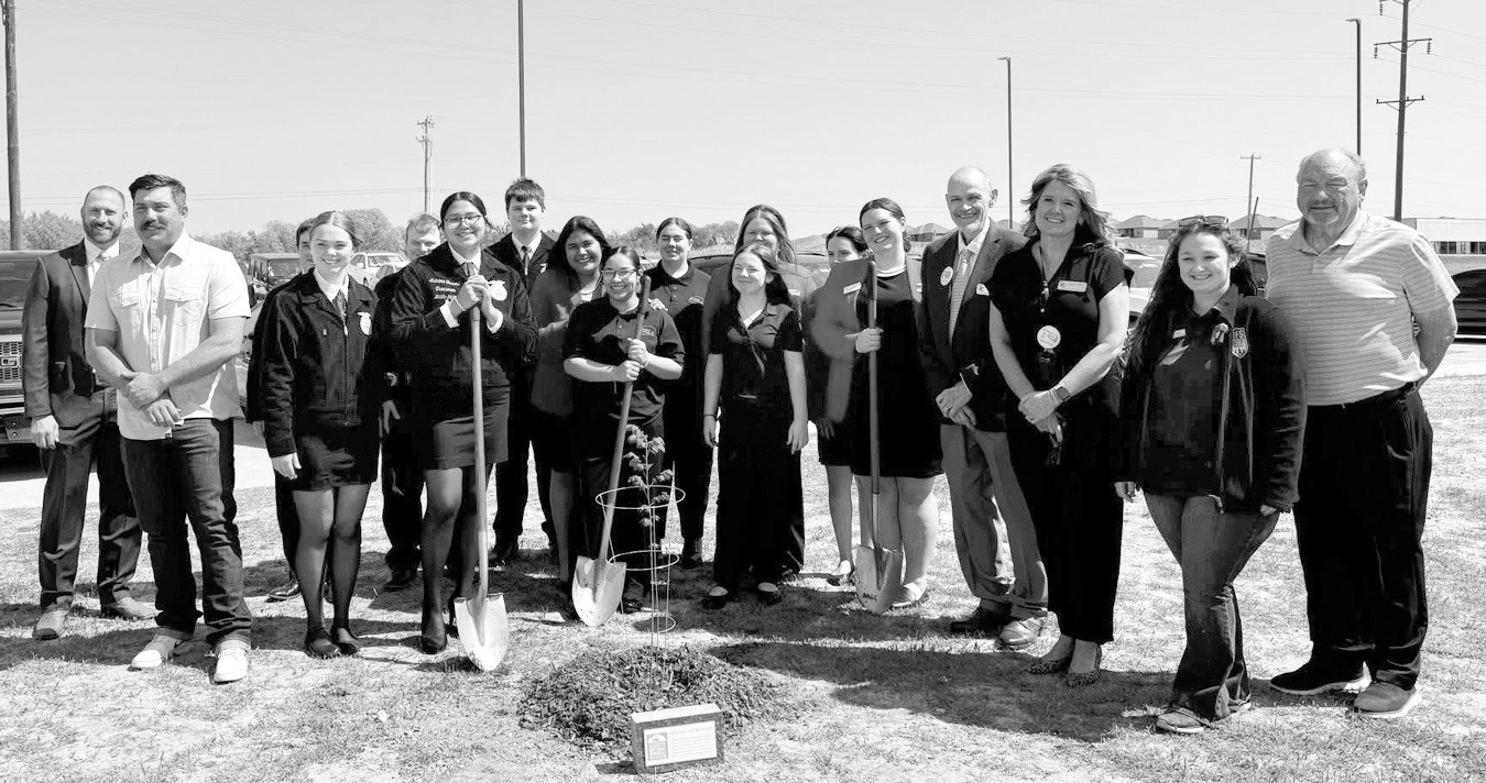 Above, Seminole FFA, FCCLA students and community members plant a “Survivor Tree” sapling at the high school on Wednesday following an assembly held to commemorate the April 19, 1995 bombing of the Murrah Federal Building in Oklahoma City, —Courtesy