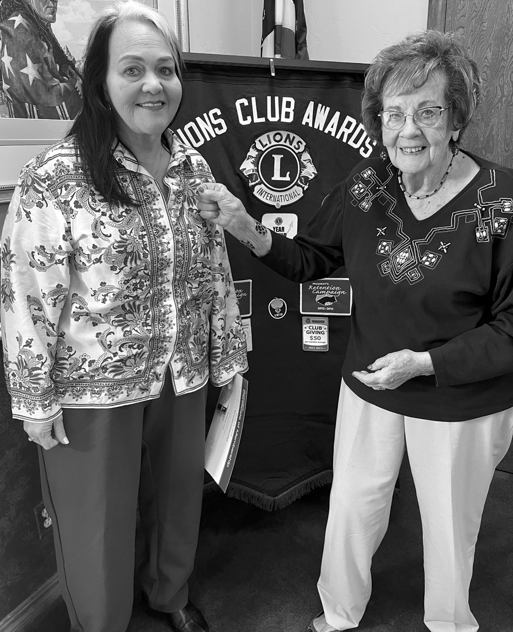 The Wewoka Lions Club welcomed new member City Manager Rebecca Stone (left) to the organization this week. She received a membership pin from Lionesses Phyllis Williamson. —Courtesy Photo