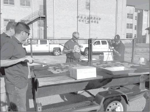 Rotary hold annual hamburger cook out
