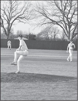 Konawa Tiger Tyler Whitley winds up for the pitch against Wetumka Friday evening. Staff Photo by Bill Anderson