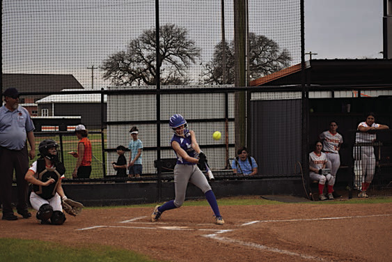 Bowlegs Lady Bison MaryBeth Dunagan knocks the ball out to the outfield Tuesday. Staff Photo by Andy Wilson