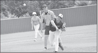 Varnum Whippet Ryan Poull winds up for the pitch against the Stuart Hornets baseball scrimmage Wednesday. Staff Photo by Bill Anderson
