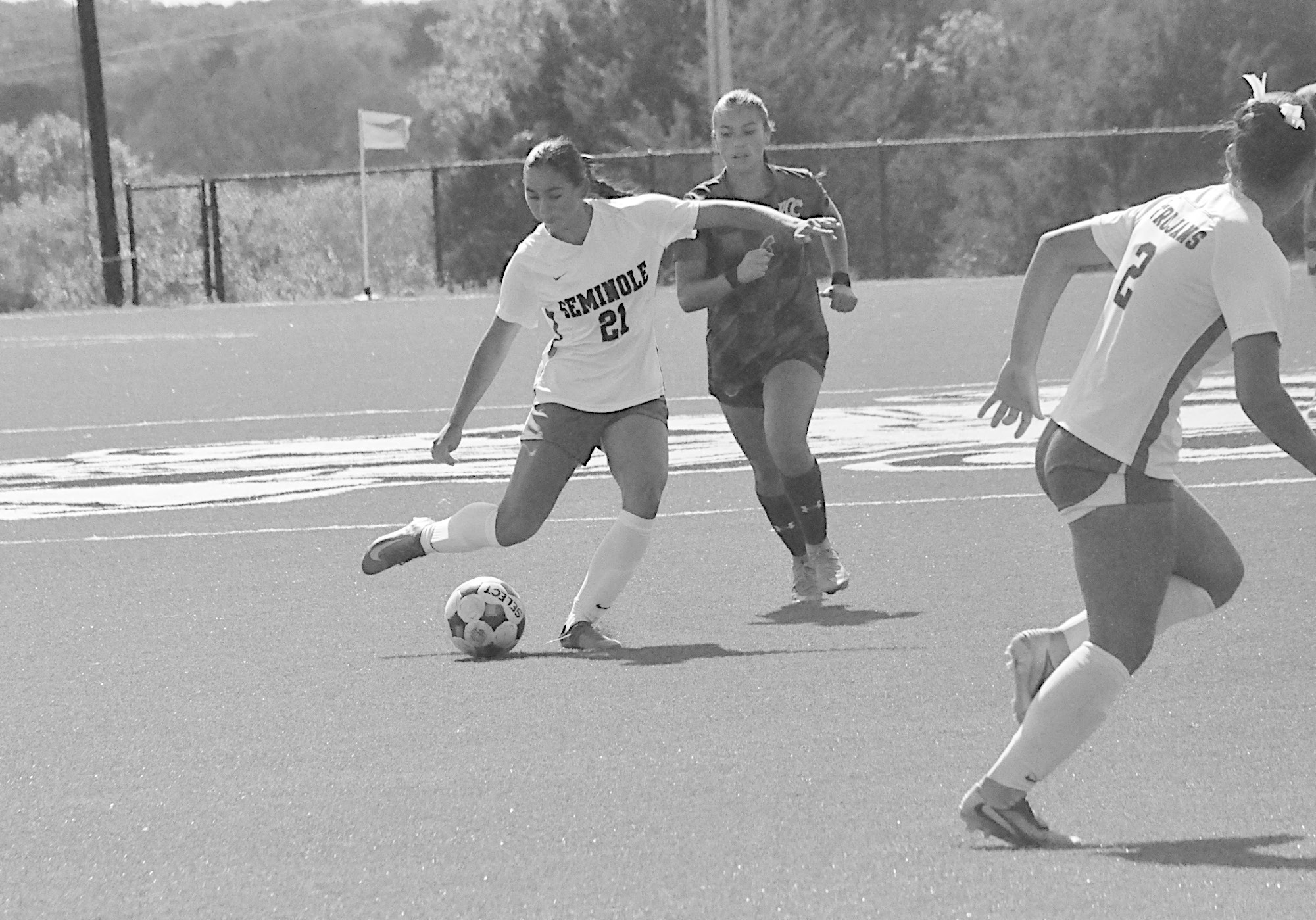 Seminole State Lady Trojan Claire Navarro gets control of the ball and sends the ball downfield to her teammate Sunday afternoon. Staff Photo by Bill Anderson