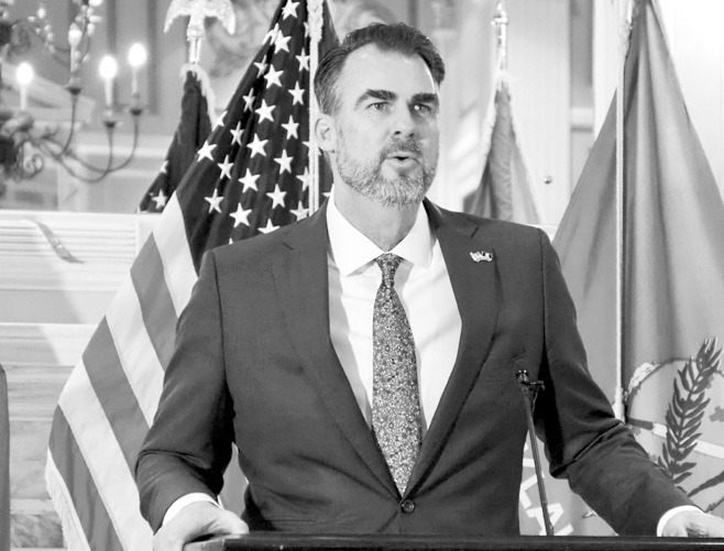 Gov. Kevin Stitt said he plans to push for cuts to Oklahomans’ personal income and corporate taxes. Stitt speaks to reporters at a news conference Jan. 29 in the state Capitol Blue Room in Oklahoma City. (Photo by Nuria Martinez-Keel/Oklahoma Voice)