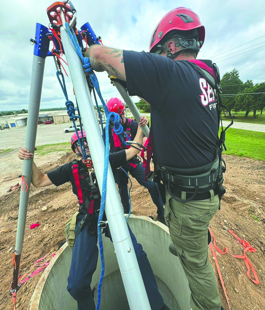 Seminole Firefighters donned rappelling gear and descended into a trench recently in a special training exercise in which they practiced removing an unresponsive patient from a compromising situation. —Photo courtesy Seminole Firefighters Assoc.