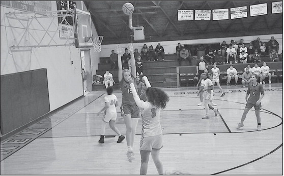 New Lima Falconette Layla Cecil makes the shot from three point range Tuesday night against Wetumka. Staff Photo by Bill Anderson