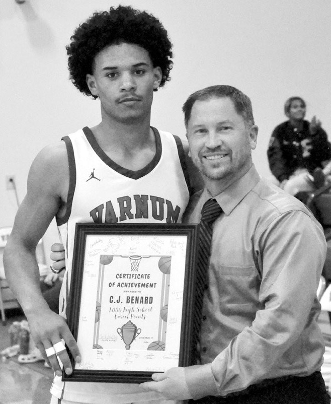 Varnum Whippet C.J. Bernard was honored this week for reaching a milestone of 1,000 points in his high school career by Head Basketball Coach Jon Hadley. Bernard reached the 1,000-point mark Dec. 17 in Lexington, Oklahoma. He was recognized before the sta