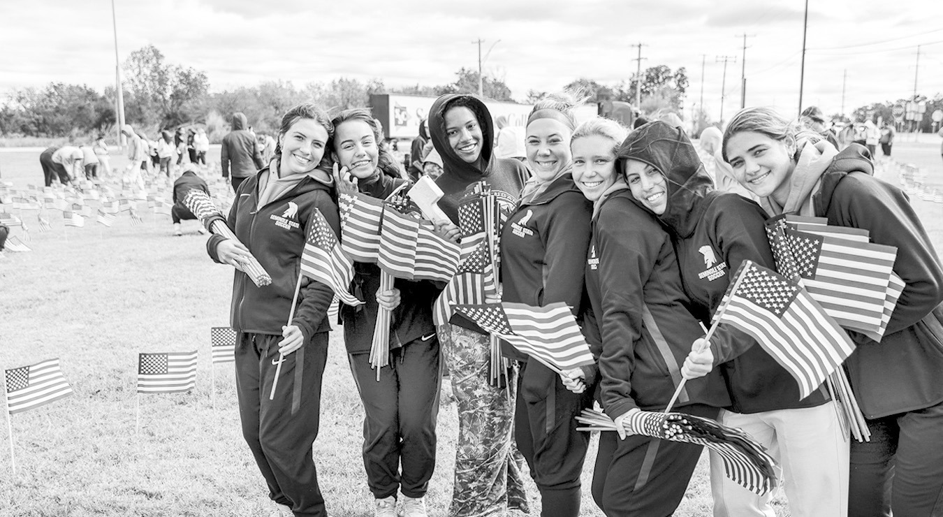 Left, SSC women’s soccer players lend a hand planting American flags on SSC’s campus. Pictured from left are Molly-Kate Lundy of Lewisville, Texas; Zoe Trenchard of Lewisville, Texas; Jillian Powell of The Colony, Texas; Bry Russell of Flower Mound, T