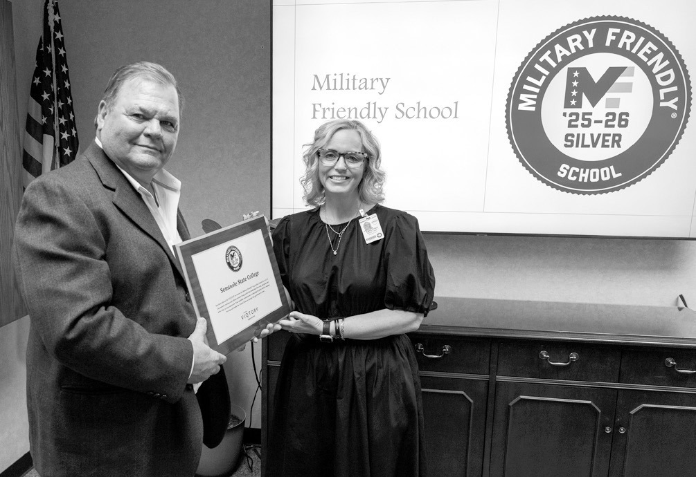 SSC Board of Regents Chair Curtis Morgan (left) presents the Military Friendly Silver Status Award to VA School Certifying Officer Stacey Foster (right) during the Board meeting on March 27. Foster was recognized for her instrumental role in helping the C