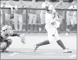 Courtesy Photo by Glen Bryan Seminole State Hector Roca has his eye on the ball as he takes the swing.