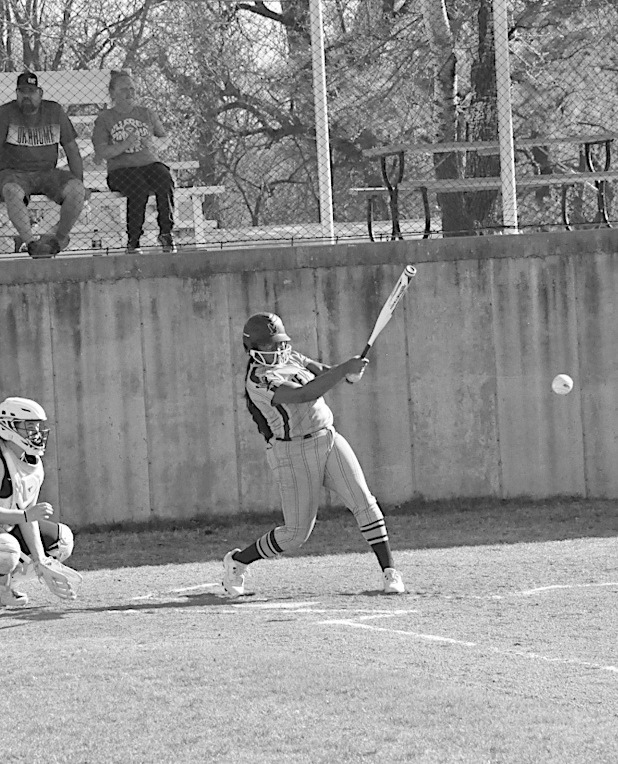 New Lima Falconette Aubrey Washington knocks one out to the infield. Staff Photo by Bill Anderson