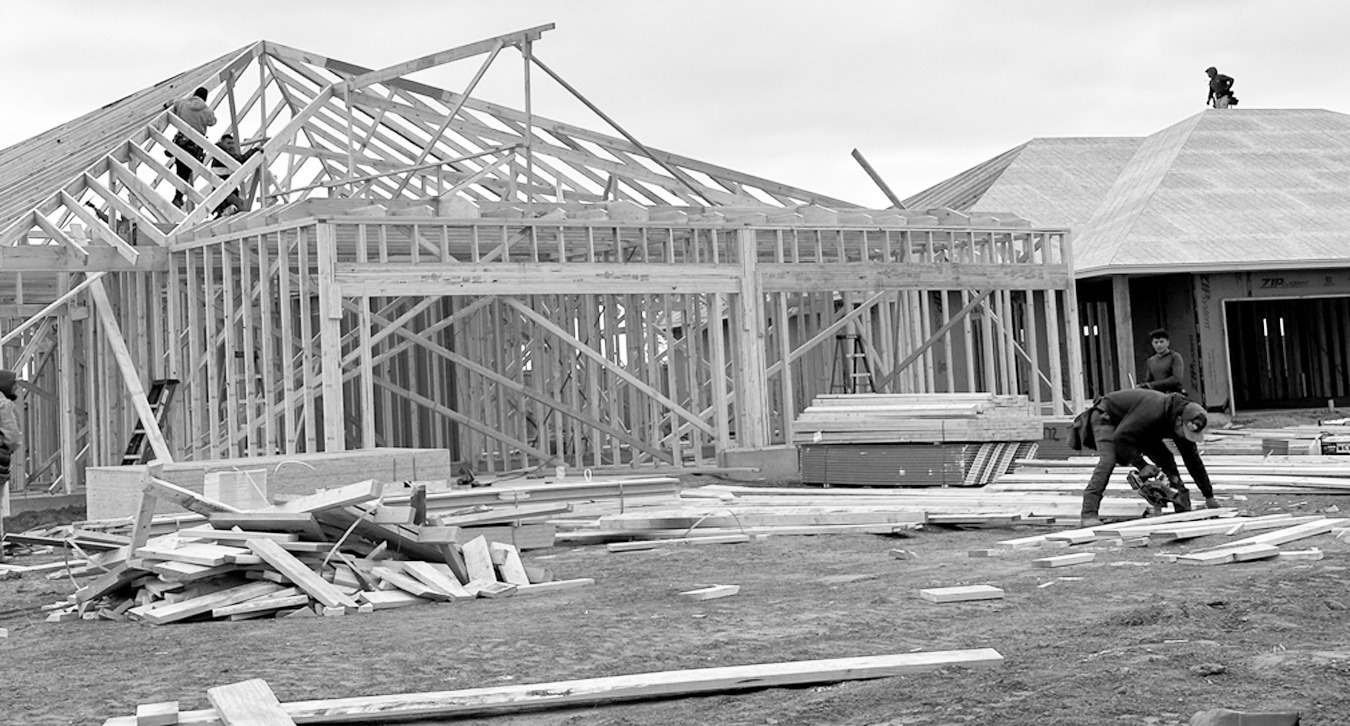 Construction workers frame a duplex in Tuttle, being built by Silva Development as part of Oklahoma’s new Housing Stability Program. (Heather Warlick/Oklahoma Watch)