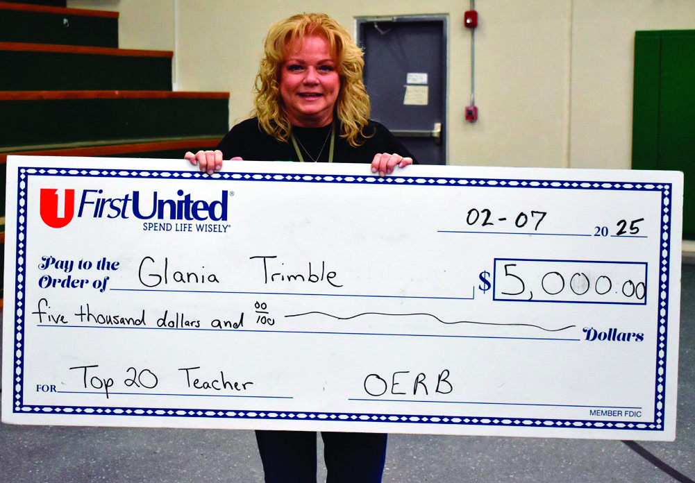 Glania Trimble was presented with a $5,000 check Friday. (Staff photo/Andy Wilson)