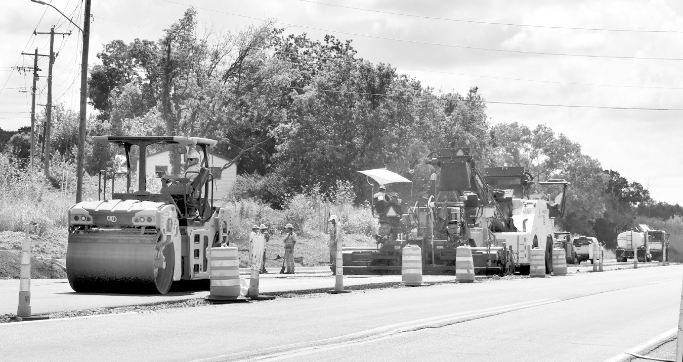 Heavy equipment was out in full force Monday morning, paving the turn lane from Highway 270 into Harvey Road. The widening of 270, which began about 10 years ago, appears to be getting closer to completion. When finished, the highway will be four lanes from Seminole to Wewoka. —Staff Photo by Andy Wilson