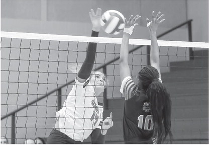 Seminole State Lady Trojan Caeli Schaefer tries to drive the ball past the defender. Courtesy Photo by Glen Bryan