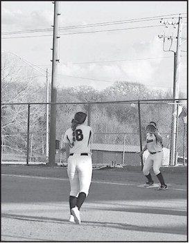 Konawa Lady Tiger pitcher throws the ball to teammate Bliss Henson to get the Allen runner out. Staff Photo by Andy Wilson