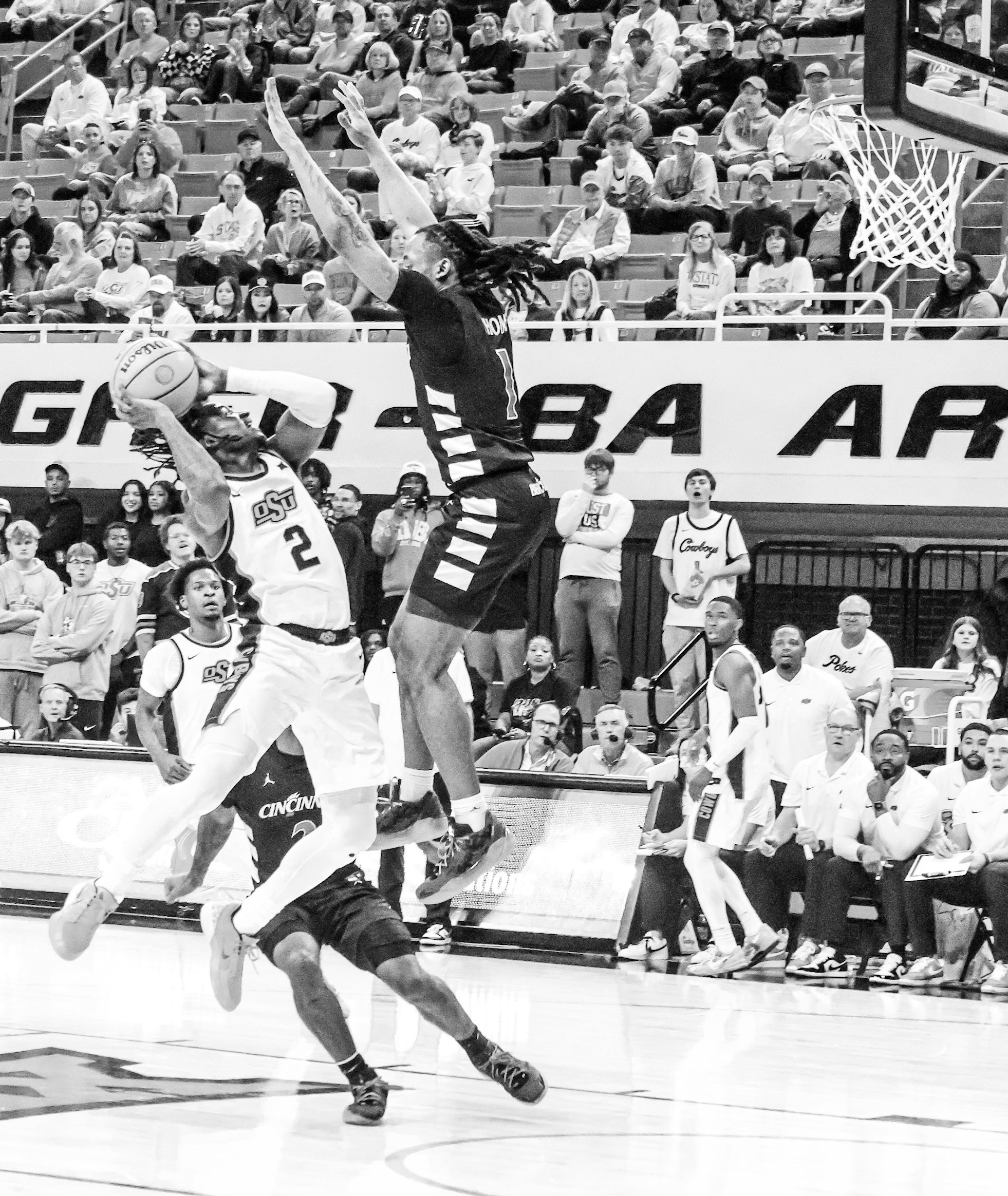 Courtesy Photo by Ben Shatzel Oklahoma State Cowboy Arturo Dean looks to score over the Cincinnati defender.