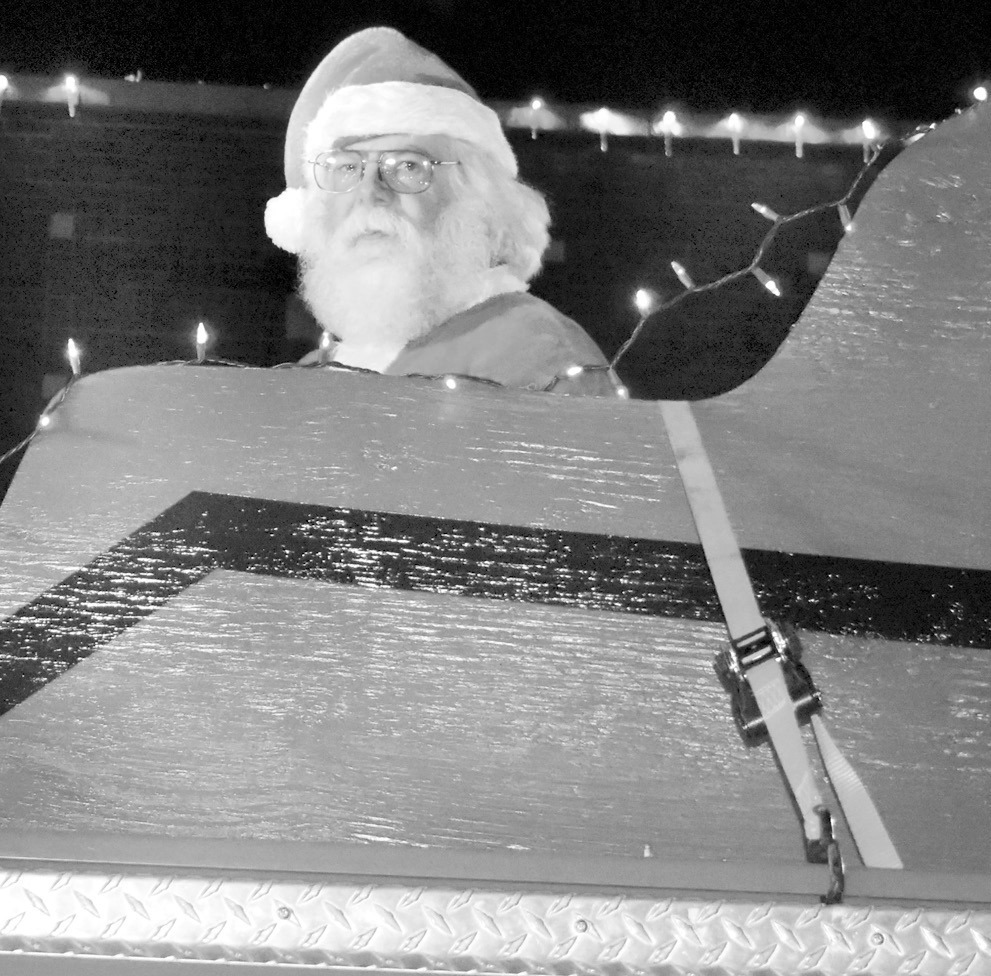Santa Claus made an early appearance in Seminole last Saturday. The jolly old elf was spotted riding in a sleigh in the city’s annual Christmas parade. But reindeer were not pulling his sleigh…it was perched atop a fire engine. —Staff photo by Andy 