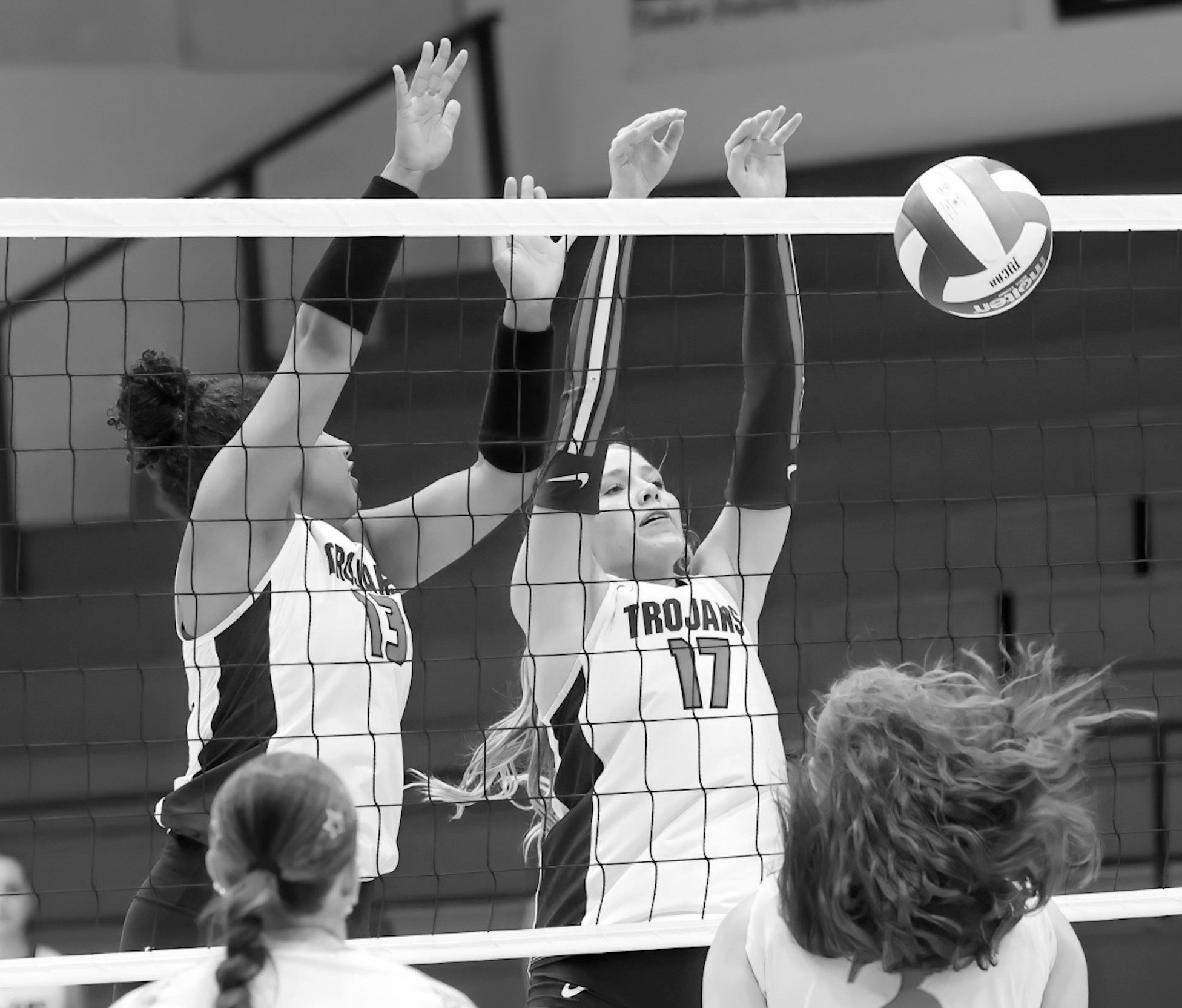 Seminole State teammates Yantzy Martinez and Kennadee Mason block at the net.