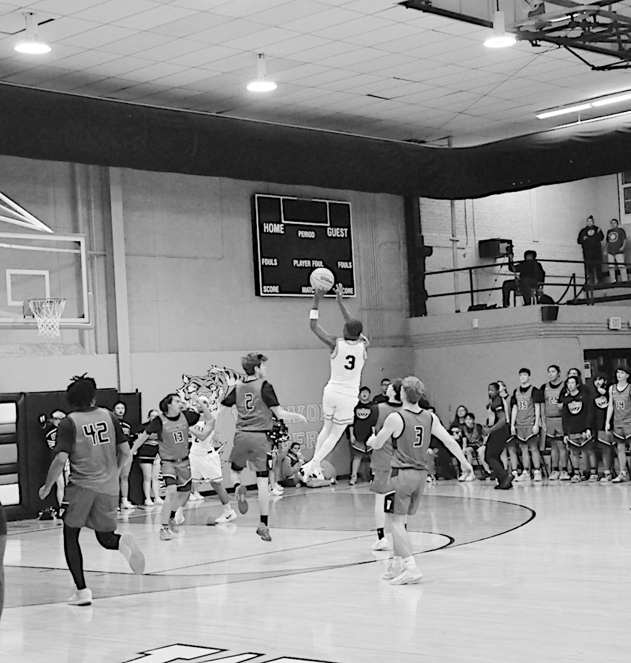 Wewoka Tiger Bill Stephens takes a shot right before the buzzer at the half. Staff Photo by Bill Anderson