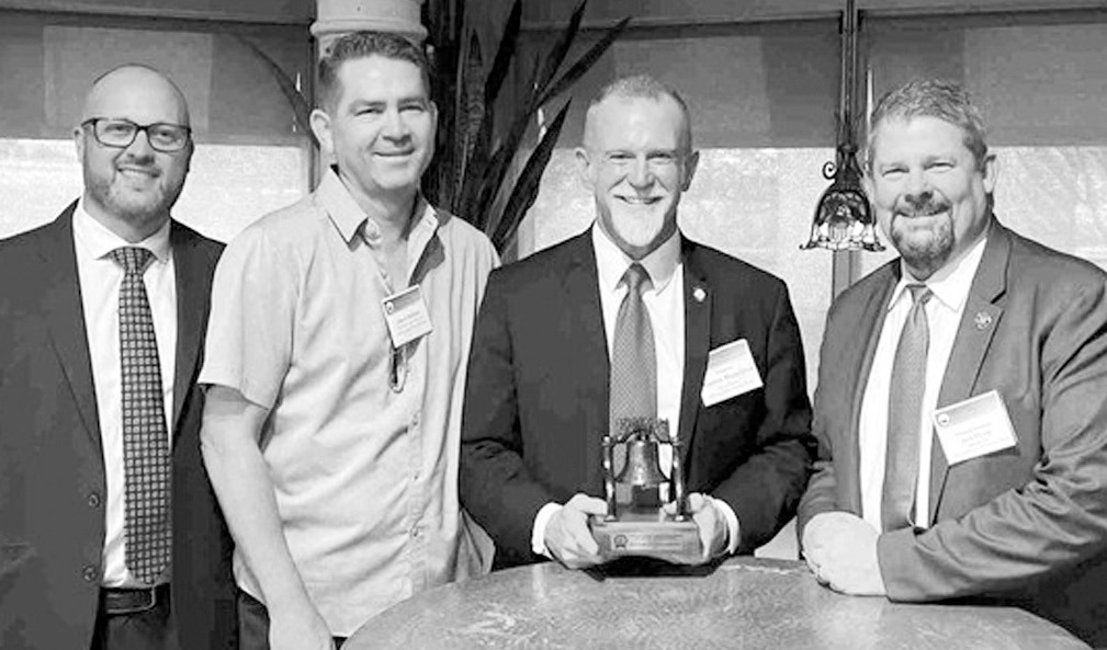 Senator Warren Hamilton, R-McCurtain, (center, with award) was recently presented the Liberty Bell Award by the Oklahoma District Attorney’s Association for his legislative efforts to protect Oklahoma’s children. (Courtesy photo)