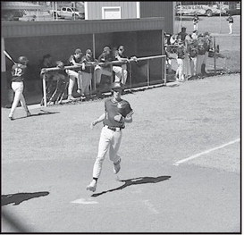 New Lima Falcon Logan Peffley scores the run Monday afternoon against Varnum. Staff Photo by Bill Anderson