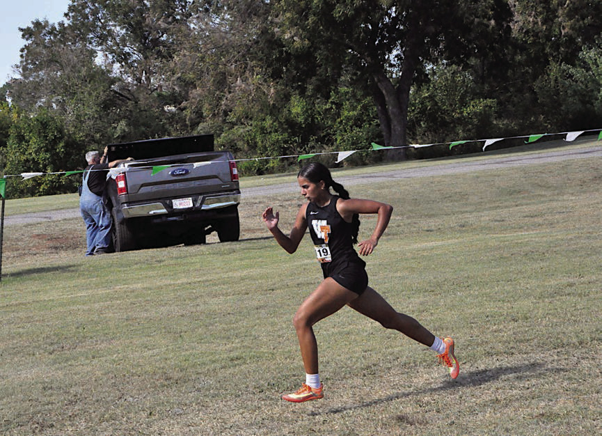 Wewoka Lady Tiger Priscilla Alaniz places first in the 3200m run at OBU Thursday. Staff Photo by Bill Anderson