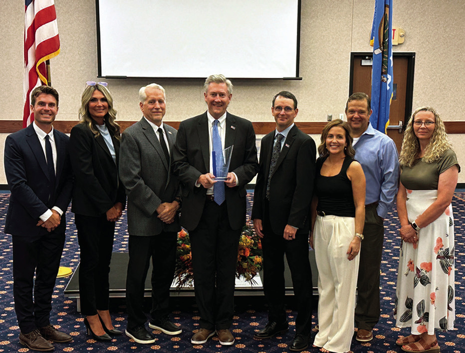 Security State Bank of Oklahoma staff accepts an award for community commitment at Seminole State College on August 4. Pictured left to right: Jesse Grandstaff, Micha Baker, Mark Schell, Tip Burch, Kassie Kincade, Aubie Keesee, John Worthy and Christi Rid