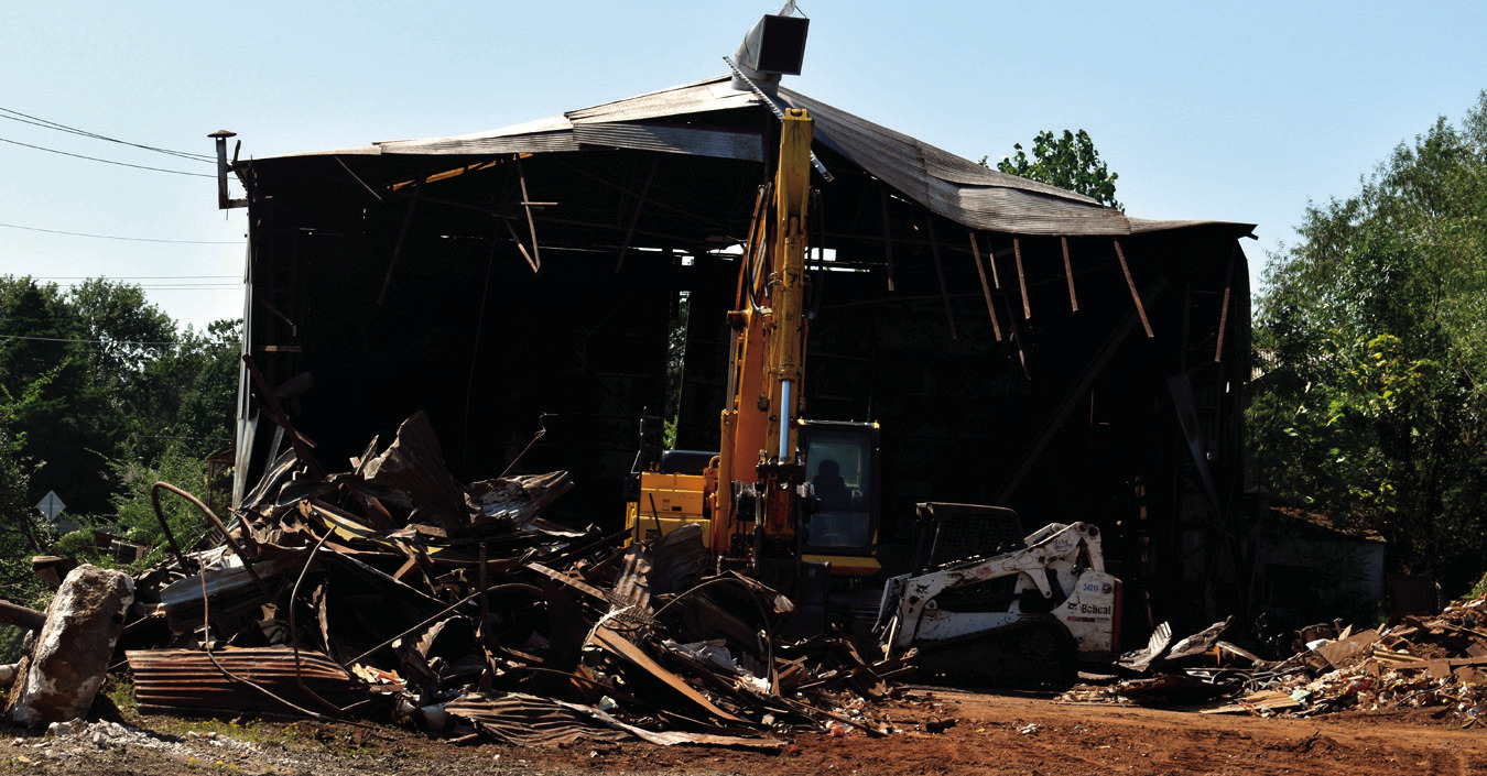 Demolition of a decades old Seminole landmark near the corner of Boren Boulevard and Strother Avenue got underway Thursday. The former U.S.A. Tank building, previously known as Independent Tank, is no more. Steel tanks used by the petroleum industry were 