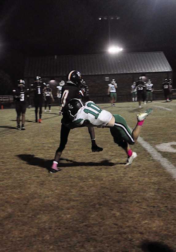 Wewoka Tiger Bill Stephens forces his way into the endzone Thursday night. Staff Photo by Bill Anderson