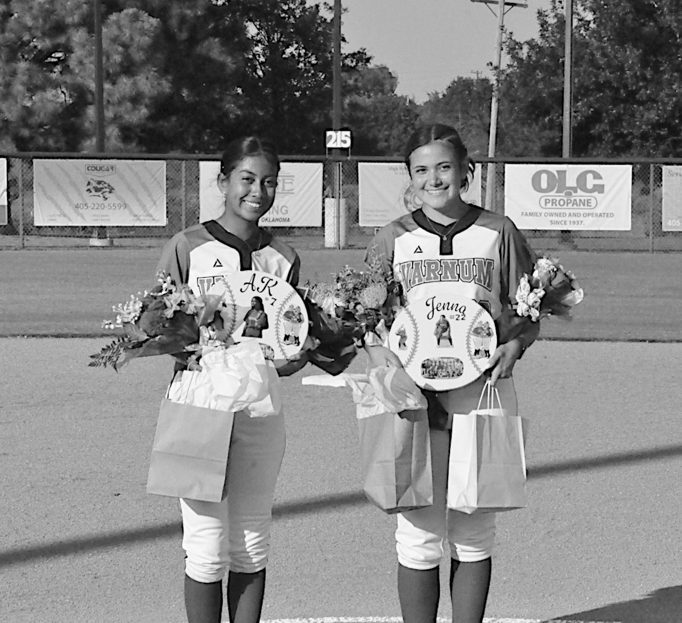 Varnum Lady Whippet Seniors AK Prieto and Jenna Lofton are honored before the game. Staff Photo by Bill Anderson