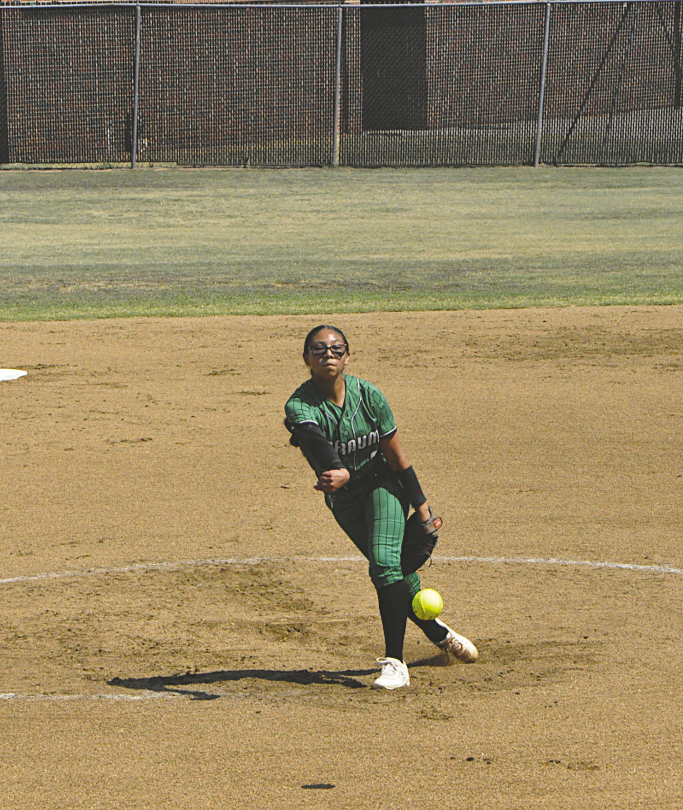 Varnum Lady Whippet Cori Vigil throws a strike against Konawa Thursday. Staff Photo by Bill Anderson