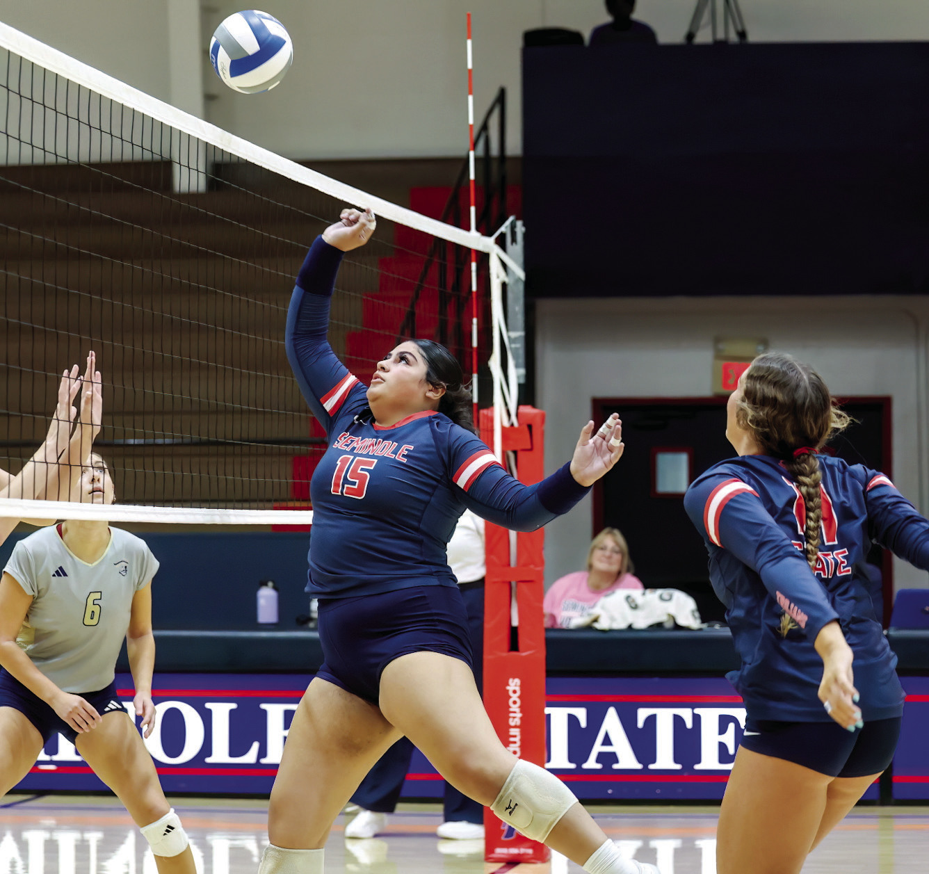 Seminole State Lady Trojan Losaline Makahununiu puts the ball back over the net. Courtesy Photo by Glen Bryan