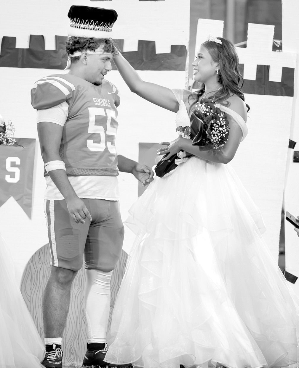 Seminole High School Homecoming Queen Tafv Stewart crowns Aiden Napier king during homecoming festivities ahead of the Chieftains matchup against Pauls Valley Friday night. The Chiefs prevailed 24-22. See page 5 for more details. —Photo by Ben Schatzel