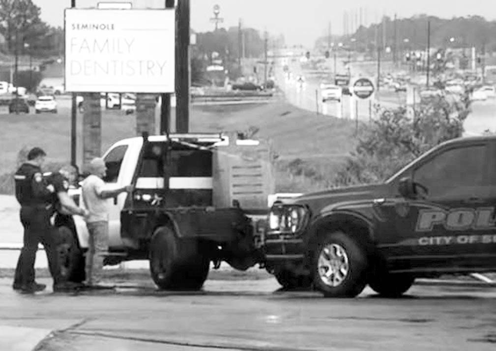 Above: Seminole Police officers arrest Thomas Agler Saturday, Oct. 18 in a business parking lot on North Milt Phillips. Agler, who pleaded no contest earlier this month to embezzlement and received probation, faces extradition to Ohio for parole violation