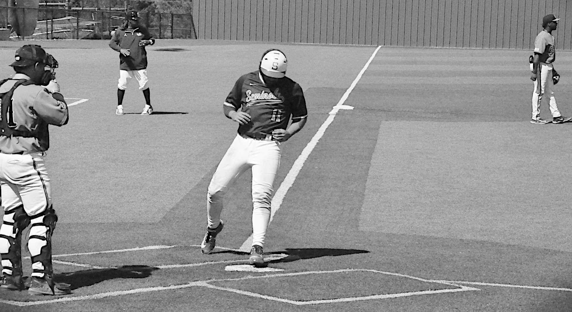 Seminole State Trojan Hunter Dearman scores the run Thursday afternoon against Connors State. Staff Photo by Bill Anderson