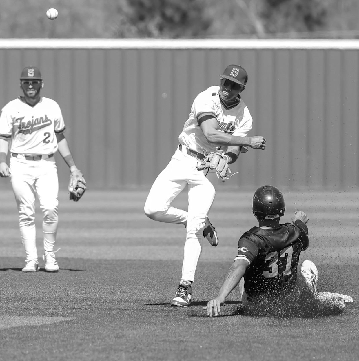 Seminole State Trojan Cohl McCoy makes a throw to first base in a double play. Courtesy Photo by Glen Bryan