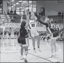 Seminole Lady Chieftain Dyliah Hymes shoots over the Okemah defenders Friday night. Courtesy Photo by Glen Bryan