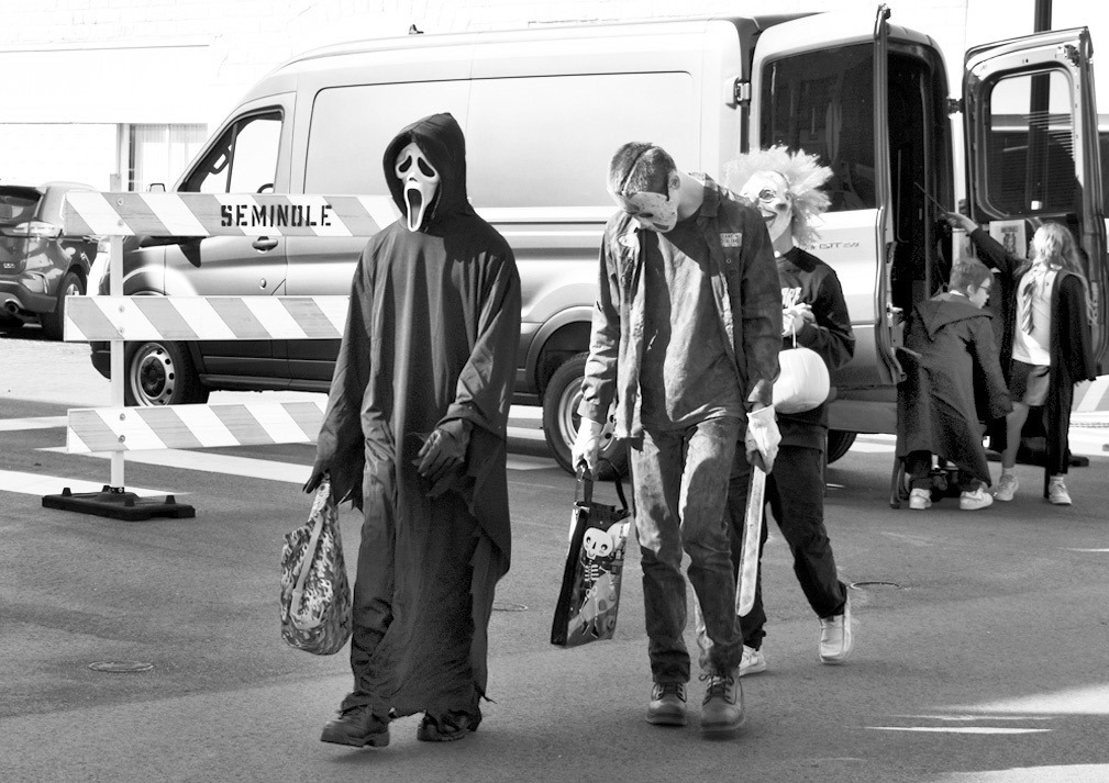 A handful of ghoulish characters make their way across Main Street in Seminole Friday afternoon during the Trunk or Treat event, which drew large numbers of people of all ages. The event included carnival games, a pumpkin decorating contest, a costume con