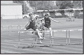 Varnum Whippet Kamell Stewart competes in the boys 110m hurdles Friday. Staff Photo by Bill Anderson